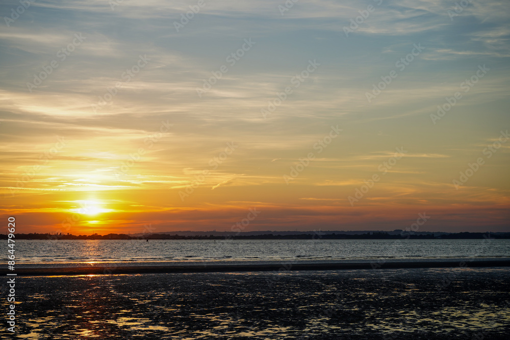 Fototapeta premium Sunset over a beach in the south of England