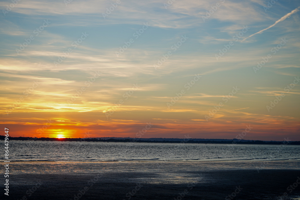 Fototapeta premium Sunset over a beach in the south of England