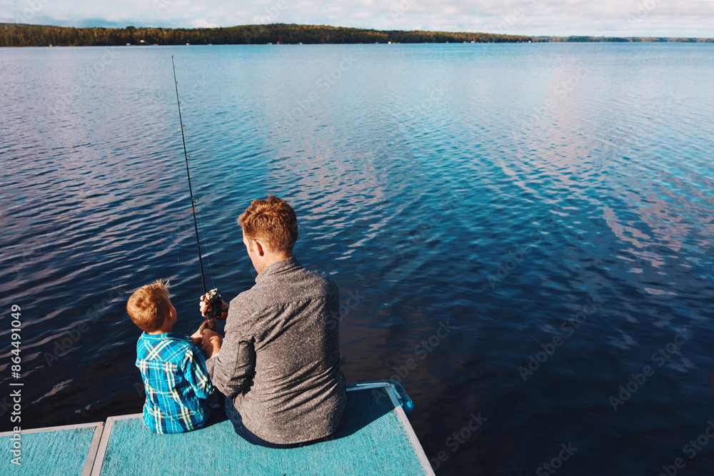 Fototapeta premium Back, child and fishing with man in summer at lake for vacation, together and relax in morning. Family, father and boy in nature by water for holiday, learning or gear for outdoor adventure with dad