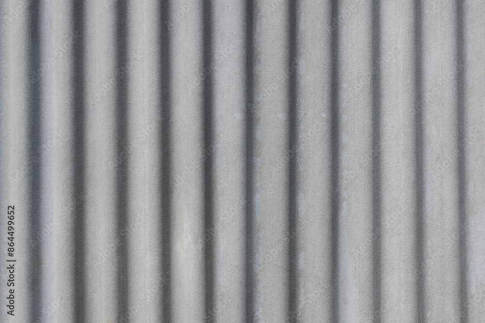 Gray cement wave roof, texture background. Texture of fiber cement roof sheet. Close up of corrugated wave asbestos tile Gray cement wave roof, texture background. Texture of fiber cement roof sheet. Close up of corrugated wave asbestos tile