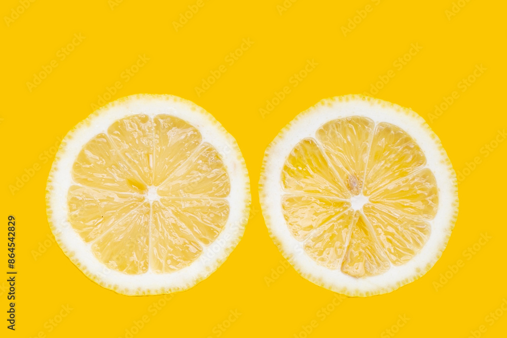 Fresh lemon slices on yellow background. Fresh lemon slices on yellow background.