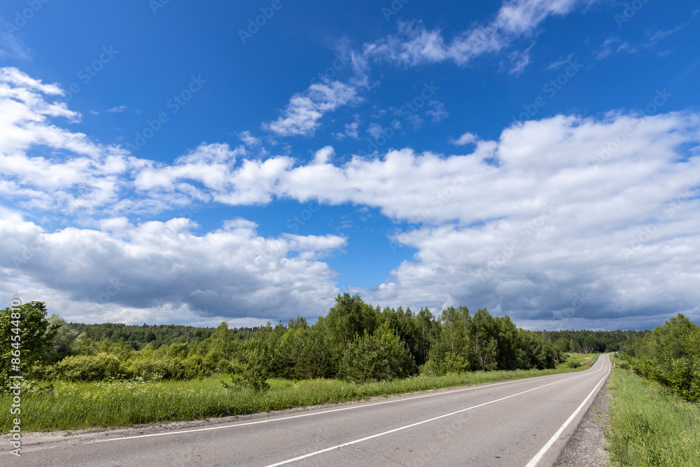 Fototapeta premium A road with a clear blue sky above it