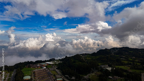 Cima, nubes y cielo azul a 2.700 metros sobre le nivel del mar. Alto de las Palmas, Antioquia, Colombia. photo