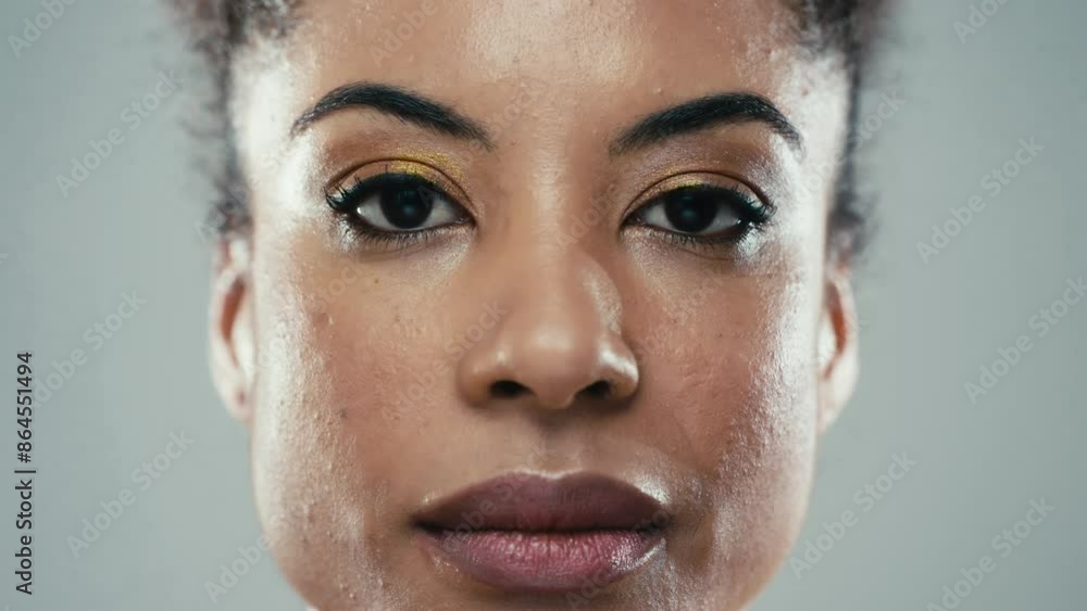Video of confident mature woman looking at camera over white background. Video of confident mature woman looking at camera over white background.