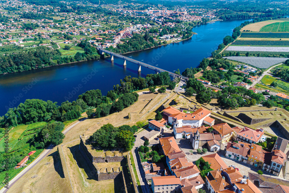 Fototapeta premium drone view of the Minho river border between Spain and Portugal, cities of Valença do Minho and Tui on each bank.