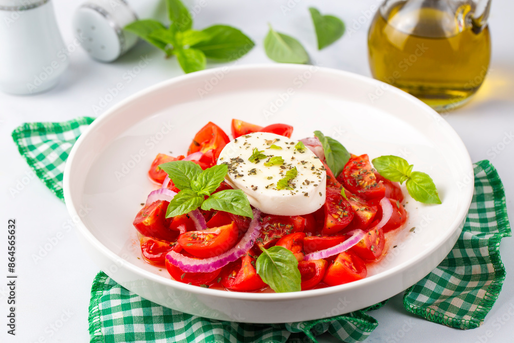 Italian caprese salad with sliced tomatoes, mozzarella, basil, olive oil Italian caprese salad with sliced tomatoes, mozzarella, basil, olive oil