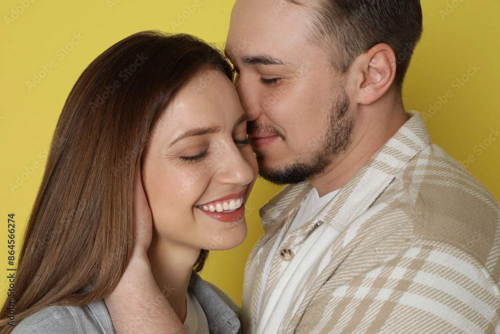 Happy couple on yellow background. Strong relationship Happy couple on yellow background. Strong relationship