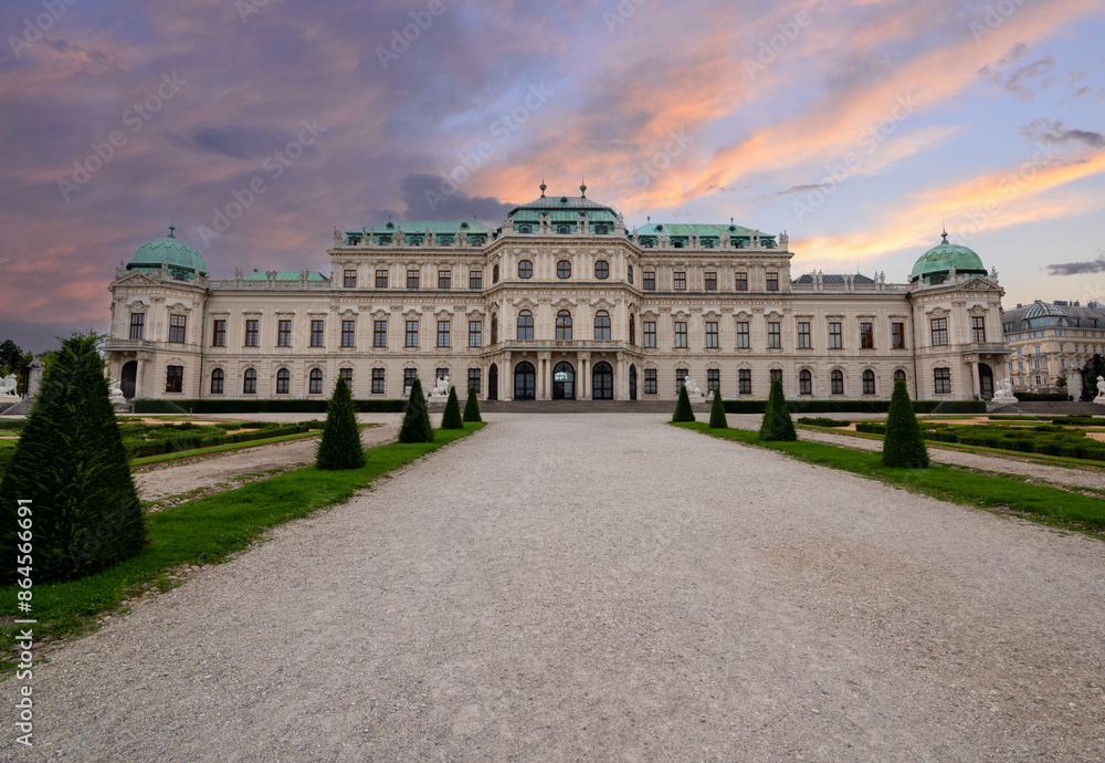 Vienna, Austria, August 18, 2022. Iconic shot of the Belvedere Palace, a fairytale atmosphere with the gardens and the avenue in perspective. Travel destinations. No people. Vienna, Austria, August 18, 2022. Iconic shot of the Belvedere Palace, a fairytale atmosphere with the gardens and the avenue in perspective. Travel destinations. No people.
