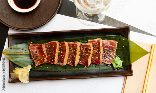 Popular Japanese dish Tataki from tuna with an appetizing ponzu sauce, prepared according to a special method photo