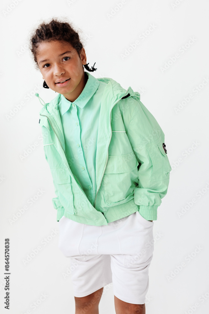 Youthful style a young boy in trendy outfit strikes a pose against a minimalist white background Youthful style a young boy in trendy outfit strikes a pose against a minimalist white background