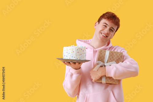 Young man with birthday cak...
