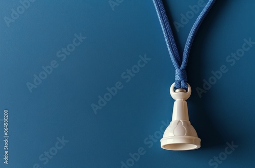 White Lanyard Clip Against a Blue Background