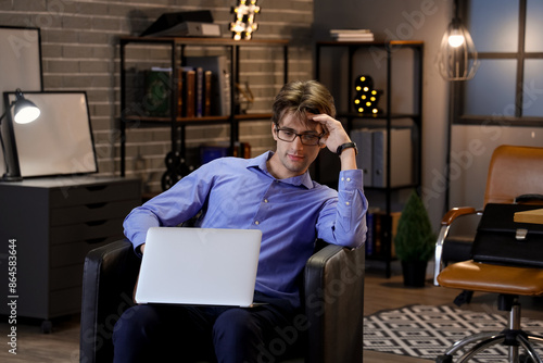 Young businessman sitting o...