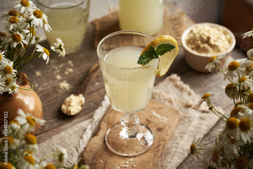 Wallpaper Mural Fresh whey in a glass and whey protein powder in the background Torontodigital.ca