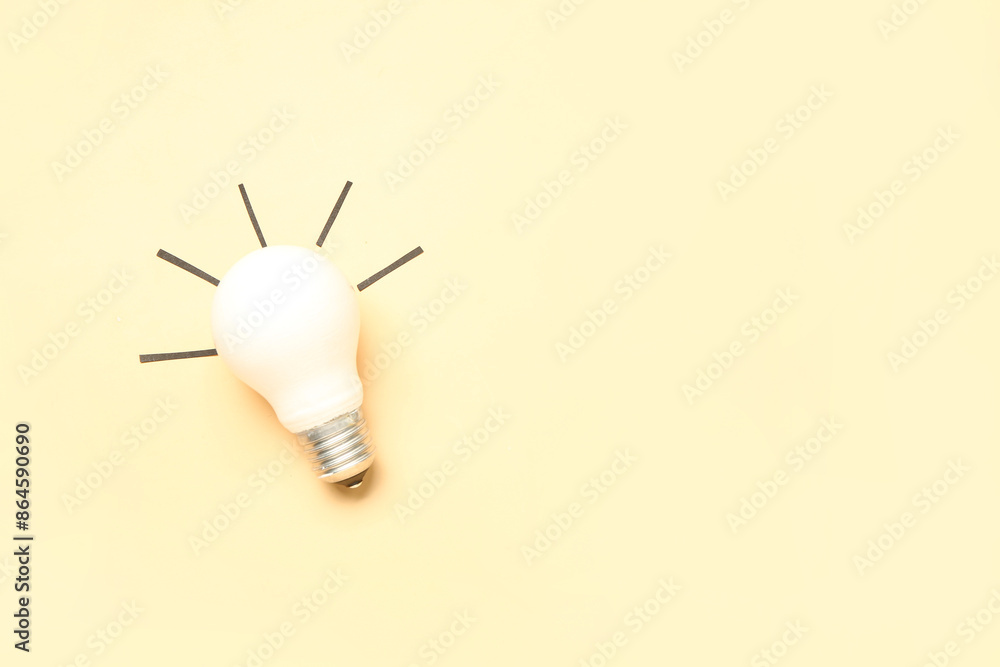 Light bulb on beige background. Business idea concept