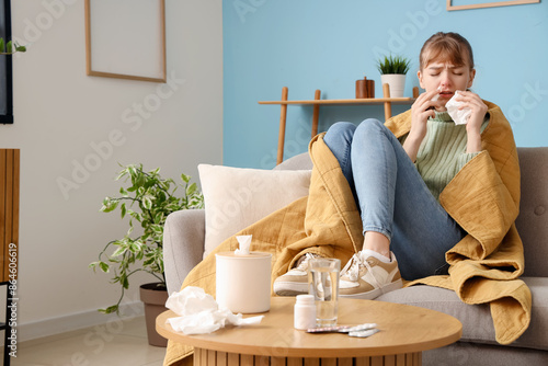 Ill young woman with nasal ...