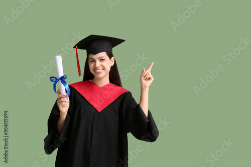 Happy female graduate with ...