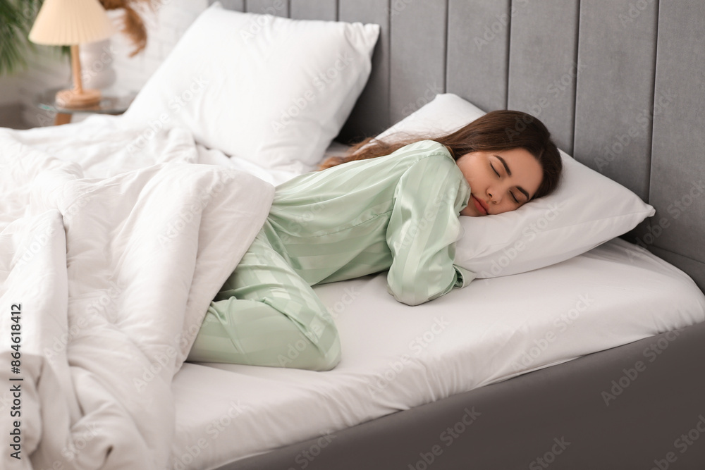 Pretty young woman sleeping in cozy bed Pretty young woman sleeping in cozy bed