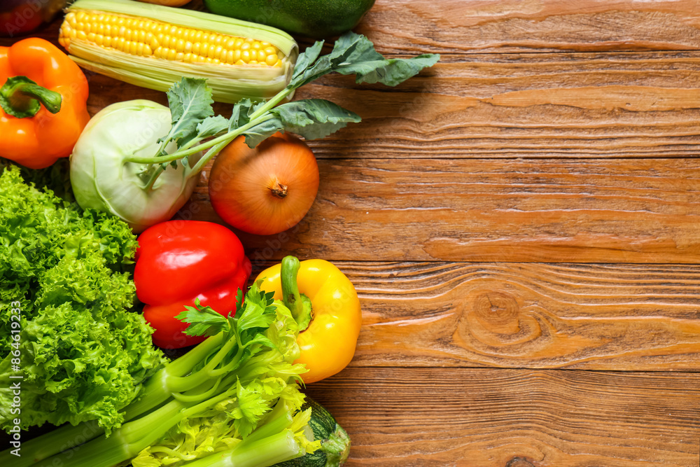 Different fresh vegetables on wooden background