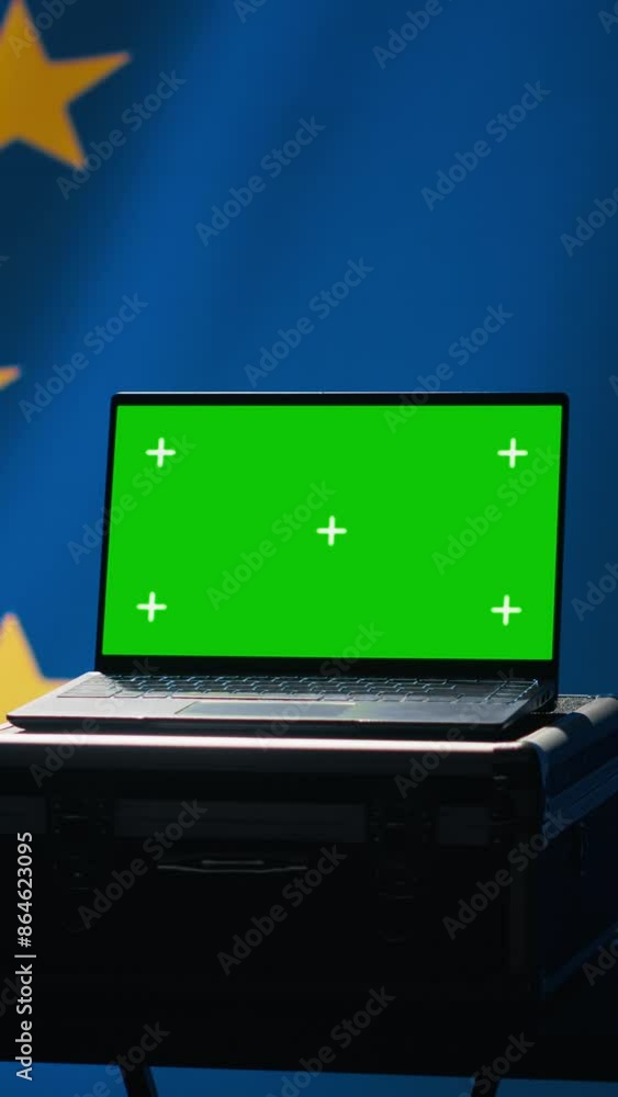 Vertical video EU alliance engineer uses green screen laptop to protect against fake accounts on social media. Technician doing cybersecurity job for European Union with mockup notebook, camera A