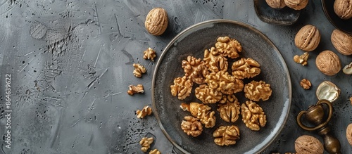 Shelled Walnuts on a Rustic Blue Tabletop With a Nutcracker