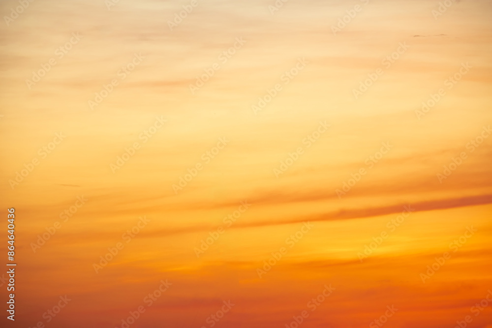Obraz premium Beautiful , luxury soft gradient orange gold clouds and sunlight on the blue sky perfect for the background, take in everning,Twilight, Large size, high definition landscape photo
