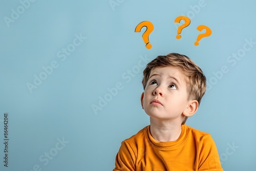 Boy Thinking with Question Marks