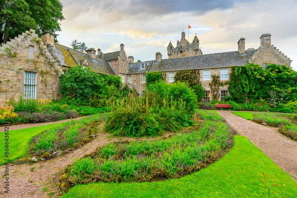 Φωτογραφία The formal garden on the grounds of the Cawdor Castle, with the tower in the distance, in Cawdor, Nairnshire, Scotland