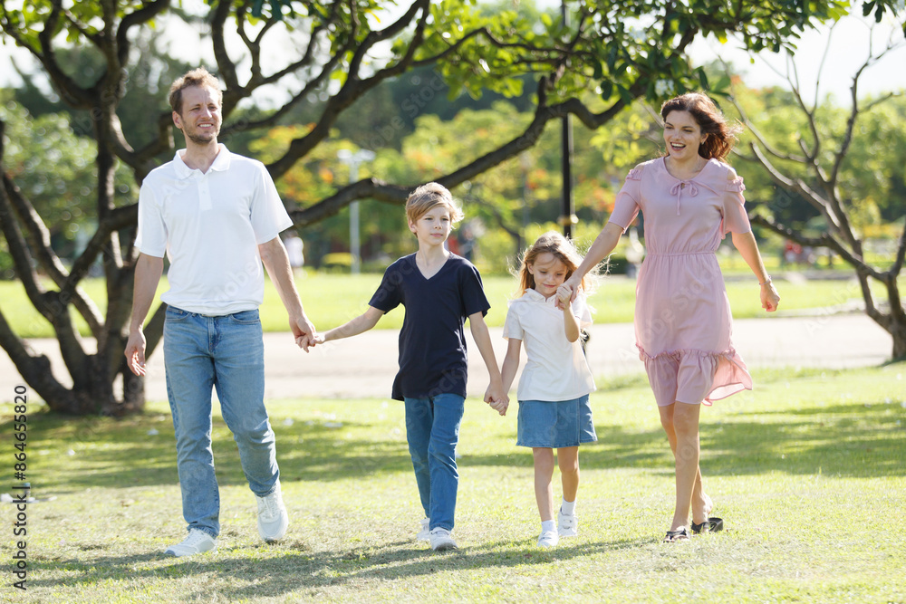 Caucasian white people family relaxing together at park. Caucasian white people family relaxing together at park.