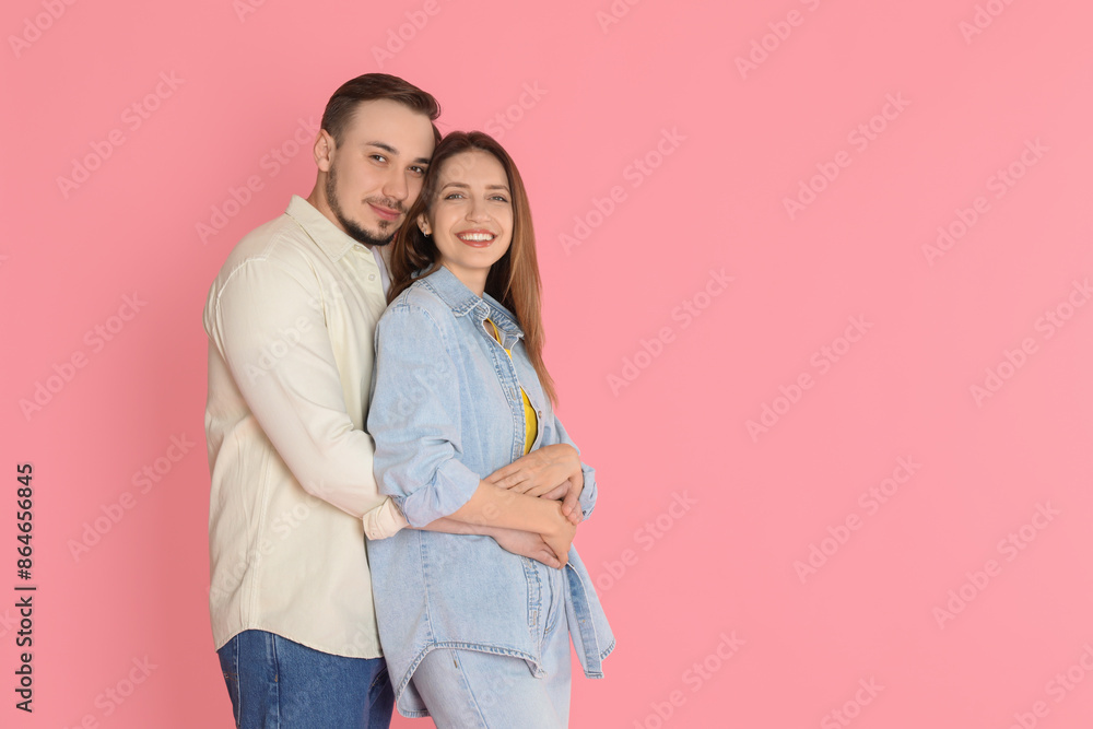 Cute couple hugging on pink background. Space for text Cute couple hugging on pink background. Space for text
