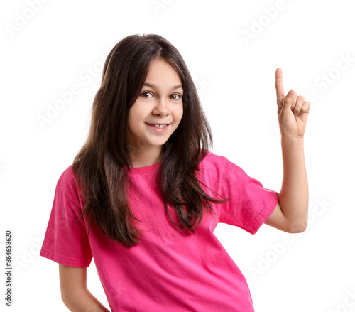 Portrait of beautiful girl pointing at something on white background