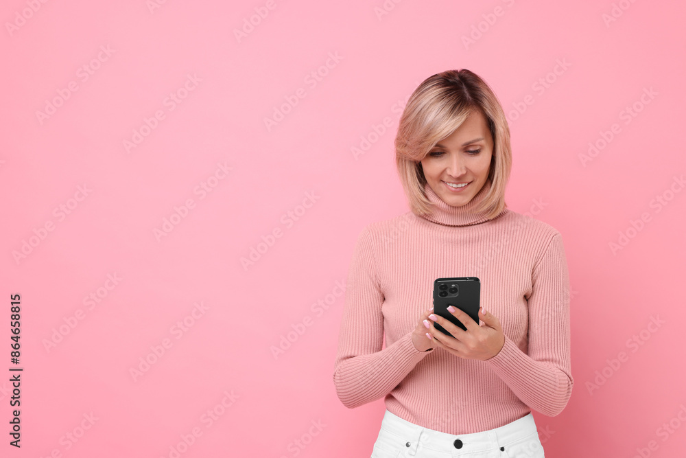 Happy woman with phone on pink background, space for text Happy woman with phone on pink background, space for text