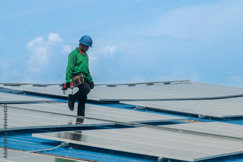 Worker Technicians are working to construct solar panels system on roof. Installing solar photovoltaic panel system. Men technicians walking on roof structure to check photovoltaic solar modules. Worker Technicians are working to construct solar panels system on roof. Installing solar photovoltaic panel system. Men technicians walking on roof structure to check photovoltaic solar modules.