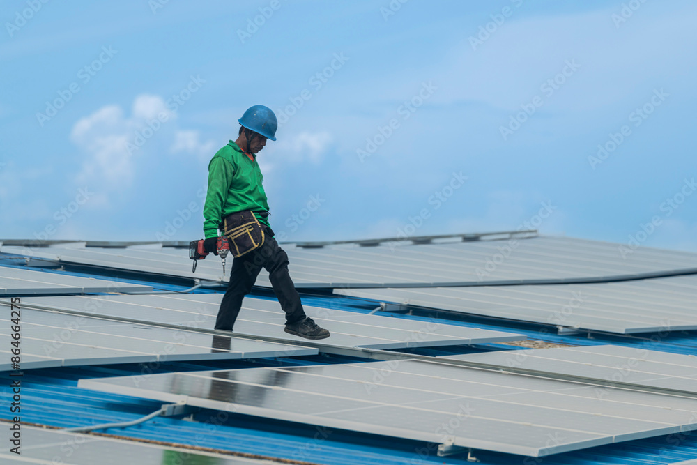 Worker Technicians are working to construct solar panels system on roof. Installing solar photovoltaic panel system. Men technicians walking on roof structure to check photovoltaic solar modules. Worker Technicians are working to construct solar panels system on roof. Installing solar photovoltaic panel system. Men technicians walking on roof structure to check photovoltaic solar modules.