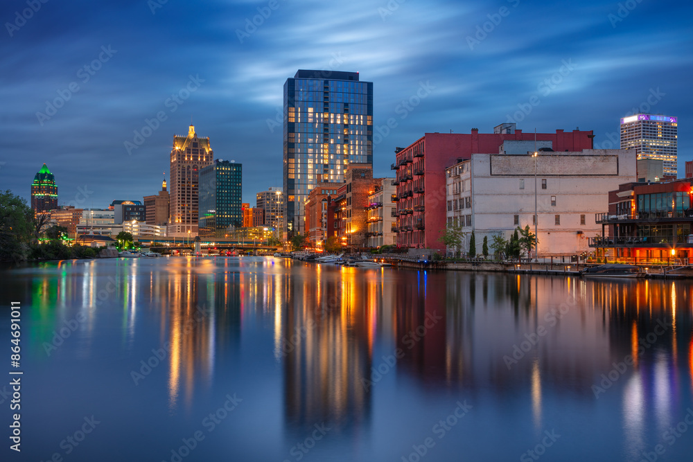 Milwaukee, Wisconsin, USA. Cityscape image of downtown Milwaukee, Wisconsin, USA with reflection of the skyline in Mnemonee River at twilight blue hour.