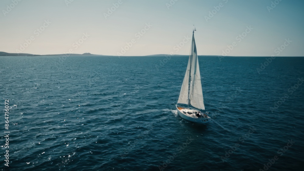 Fototapeta premium sailboat in the middle of a body of water with a boat in the background