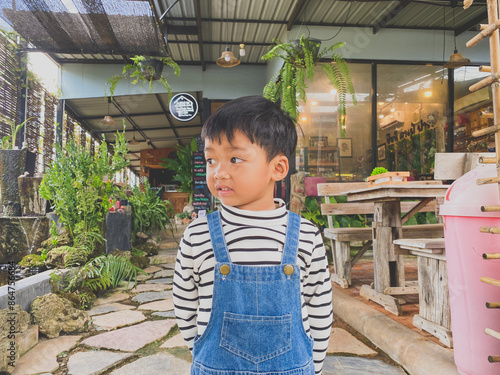Wallpaper Mural Portrait of a smiling boy, embodying joy and childhood happiness indoors Torontodigital.ca