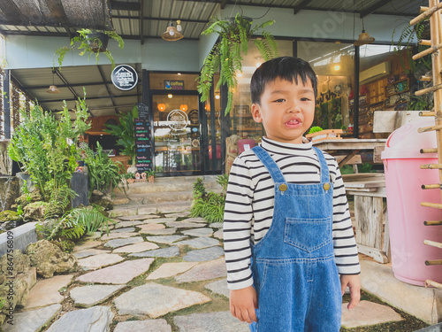 Wallpaper Mural Portrait of a smiling boy, embodying joy and childhood happiness indoors Torontodigital.ca