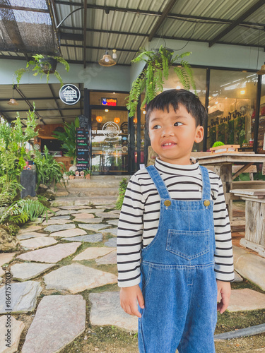Wallpaper Mural Portrait of a smiling boy, embodying joy and childhood happiness indoors Torontodigital.ca