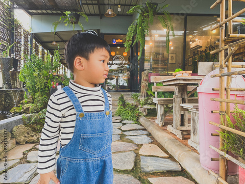Wallpaper Mural Portrait of a smiling boy, embodying joy and childhood happiness indoors Torontodigital.ca