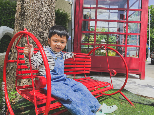 Wallpaper Mural Children playing happily on a colorful playground in a sunny park filled with slides, swings, and other fun equipment under a bright blue sky Torontodigital.ca