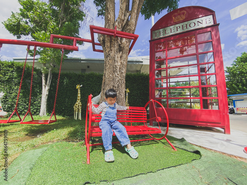 Wallpaper Mural Children playing happily on a colorful playground in a sunny park filled with slides, swings, and other fun equipment under a bright blue sky Torontodigital.ca