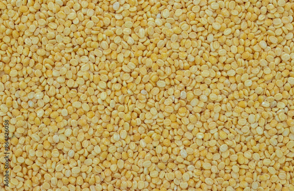 Yellow Moong Dal or Green Gram Beans Background with Copy Space in Horizontal Orientation Yellow Moong Dal or Green Gram Beans Background with Copy Space in Horizontal Orientation