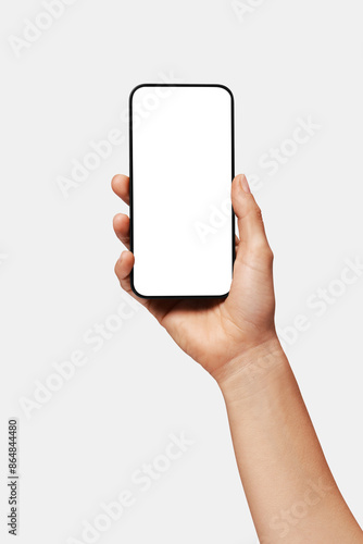 Close-up of woman hand holding modern smartphone iphone mockup. New modern black frameless smartphone mockup with blank white screen. Isolated on white background high-quality studio shot, Modern smar