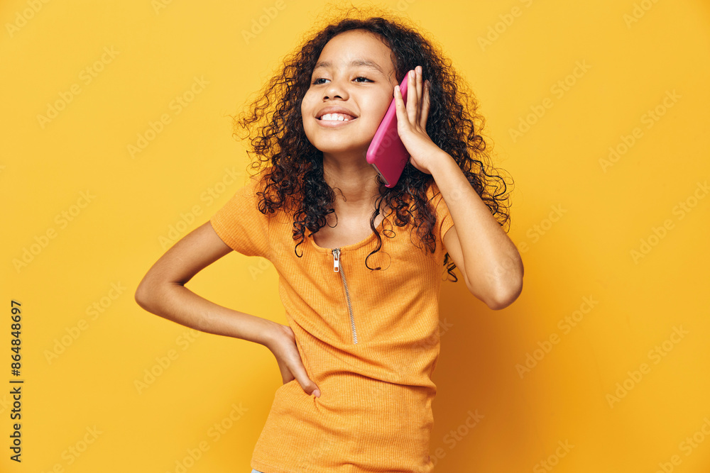 Fototapeta premium Woman girl yellow female childhood person happy background background cute portrait young girl beauty