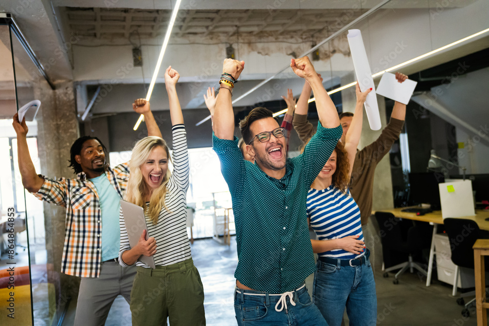 Fototapeta premium Happy business people celebrating success at company