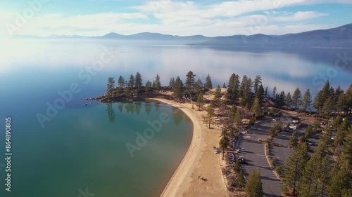 Sand Harbor, Lake Tahoe USA, Aerial View of Beach, Park and Sky Reflection on Calm Water on Sunny Winter Day photo