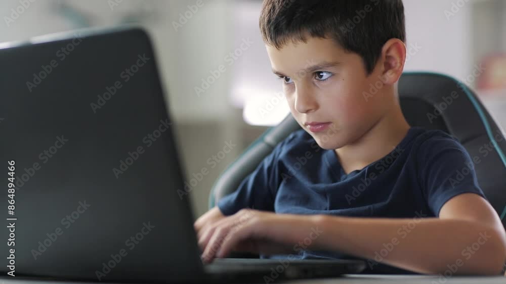 smart boy proggramer working on his laptop at home, writing computer code. smart boy proggramer working on his laptop at home, writing computer code.