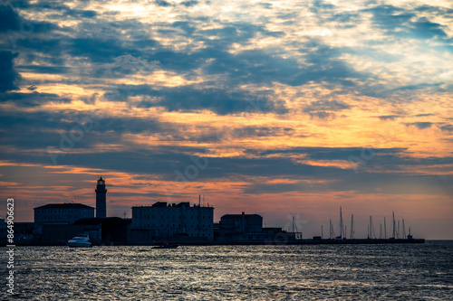 Historic city of Trieste. Between ancient buildings and reflections on the sea. Autumn day and celebration of the Barcolana International Regatta.