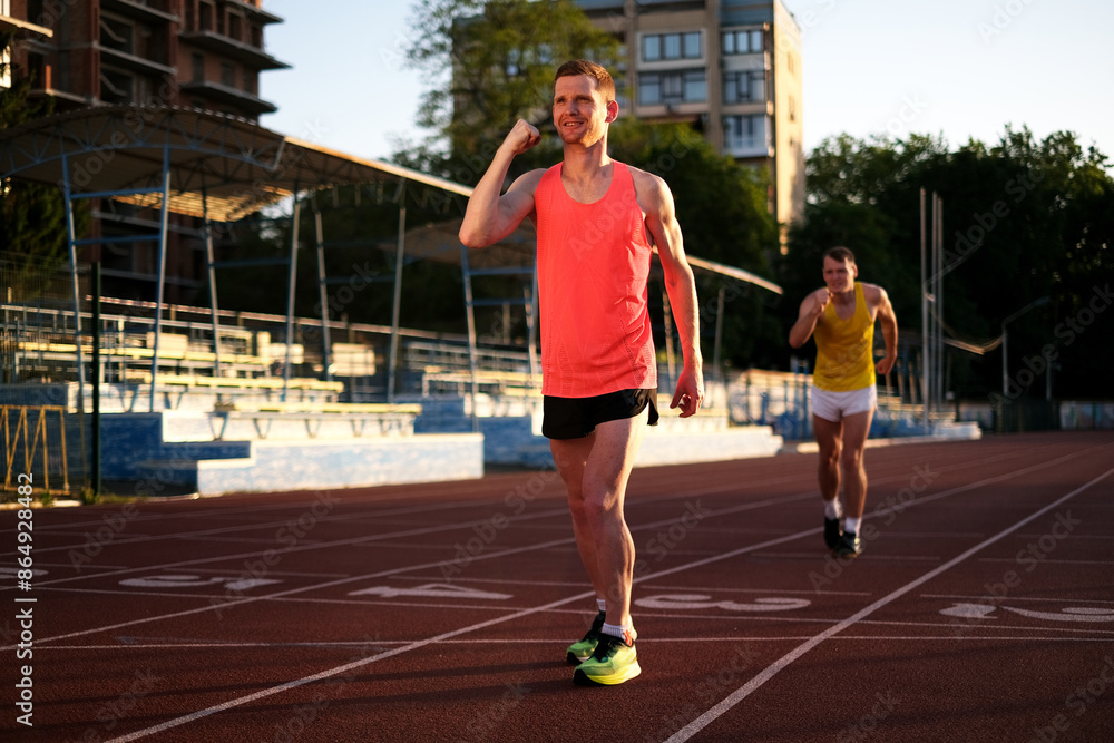 Obraz premium athlete rejoices at victory in marathon at stadium